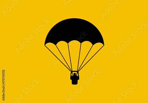 Parachute on yellow backdrop Person descends in black silhouette