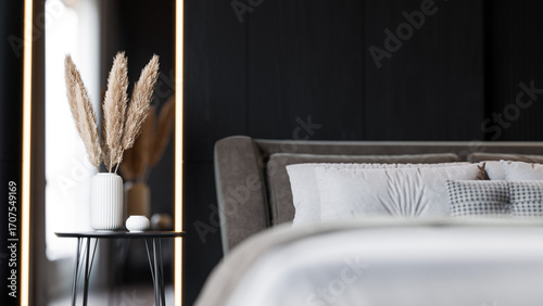Modern Minimalist Bedroom Interior with Dark Walls and Elegant Lighting