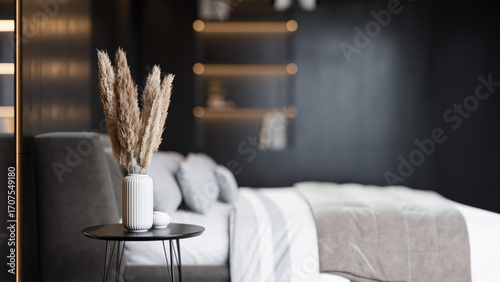 Modern Minimalist Bedroom Interior with Dark Walls and Elegant Lighting