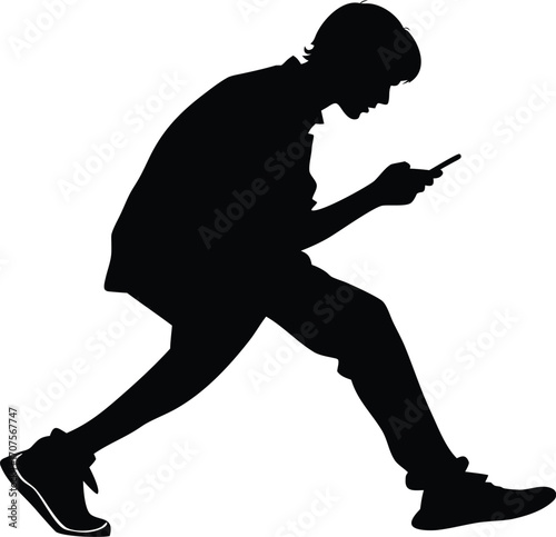 Young man walking while using smartphone silhouette