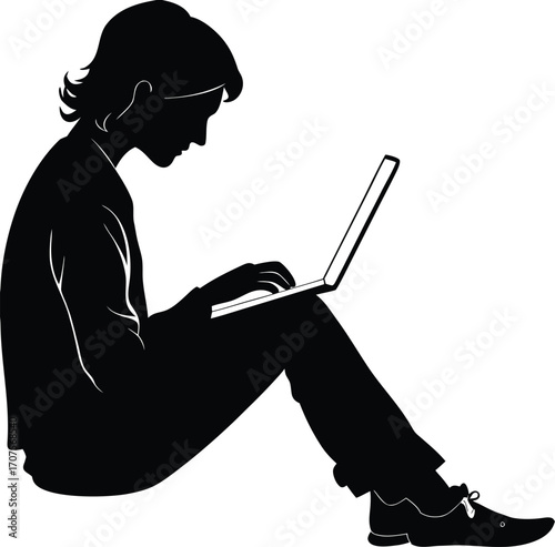 Young person working on laptop computer silhouette