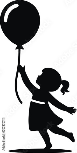 Silhouette of a little girl with a balloon reaching up