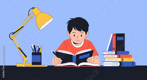 A young boy is diligently studying a book at his desk illuminated by a desk lamp.