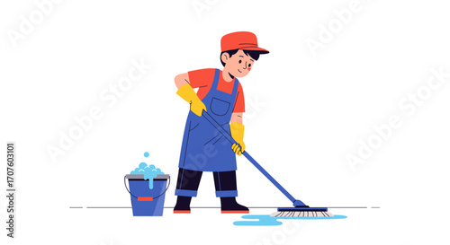 A young boy wearing a red cap and blue overalls is mopping the floor with a blue bucket filled with soap suds and water nearby.