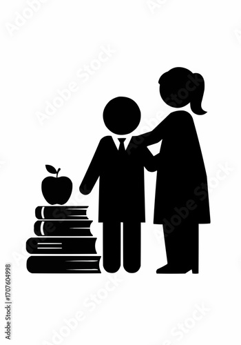 Silhouette of a teacher guiding a student beside a pile of books and apple.