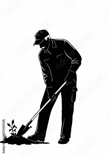 A dedicated gardener planting a seedling with a shovel.