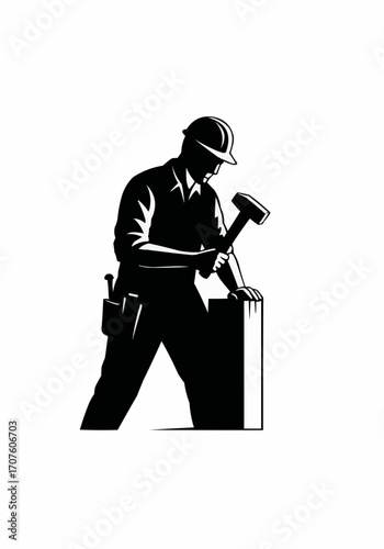 An architectural craftsman is silhouetted while working, engaged in construction with a hammer