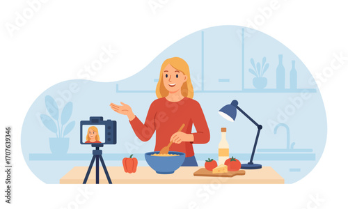 Smiling food vlogger records a step by step recipe in cozy kitchen using camera and tripod. Chef live streaming cooking new recipe. Content, social media posts creation. Video tutorial, culinary show