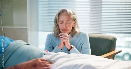 Healthcare, hospital and old woman praying with husband for recovery from operation or surgery. Faith, medical and prayer with senior couple in clinic together for belief, rehabilitation or treatment