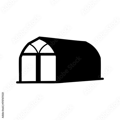 Black and white image of a greenhouse with a unique design