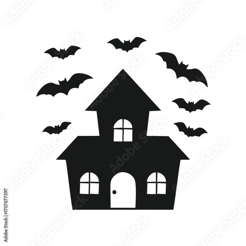 Black silhouette of a haunted house with bats flying around