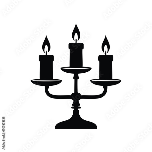 Black silhouette of a simple three-branched candelabra with lit candles Keywords: candelabra