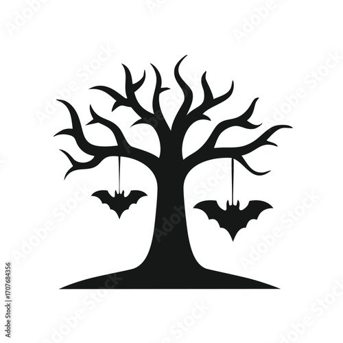Silhouette of a bare tree with bats hanging from branches