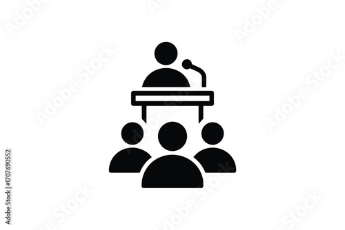 Speaker addressing an audience at a podium with microphone