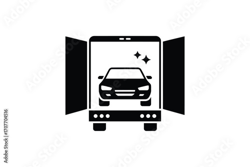 Car being transported inside an open trailer