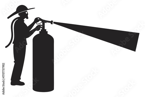 Silhouette of a firefighter using a fire extinguisher.