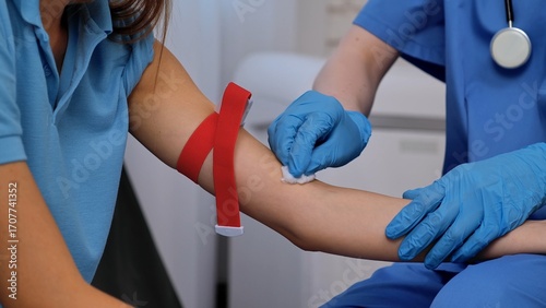 Wallpaper Mural Healthcare Professional Preparing for Blood Collection Procedure Carefully Torontodigital.ca