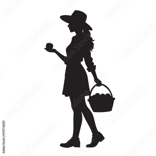 Silhouette of a woman in casual attire carrying a basket of apples and holding an apple, expressing rural charm and simplicity, great for agriculture, lifestyle, or countryside-themed concepts.