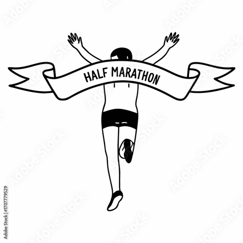 Runner crossing finish line with arms raised and half marathon ribbon running
