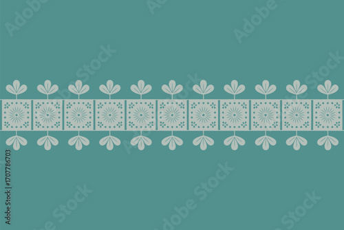 Decorative border with repeating square floral patterns and leaf accents on a teal background surface