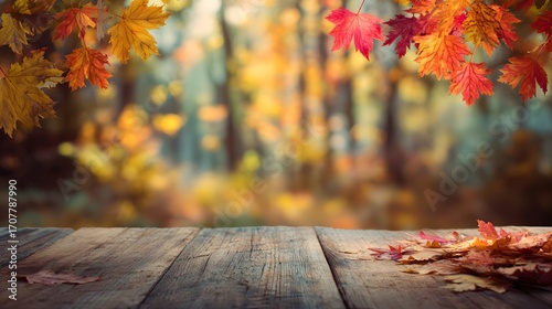 Autumn table with orange leaves on wooden planks in the forest