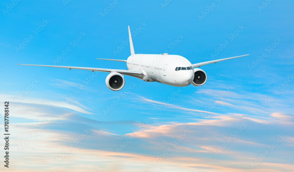 Obraz premium White passenger airplane flying in the sky amazing clouds in the background - Travel by air transport