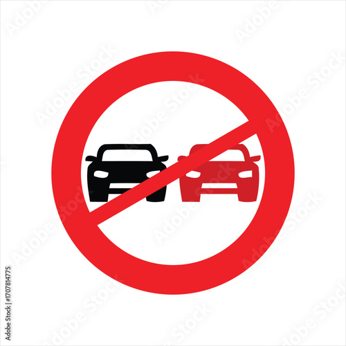 A red circular prohibition sign with a diagonal line over two cars, indicating no overtaking on the road.