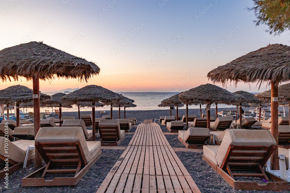 Fototapeta premium beach chairs and umbrellas on the beach