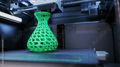 Wide Angle of Creating a Detailed Green Vase With 3D Printer in Workshop