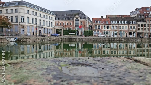 Lille, France - 17 October 2024 - Scenic Reflection of Historic Buildings on a Tranquil Waterway at Le quai du Wault ( Le quai du Wault ) one of the two old ports of Lille, France