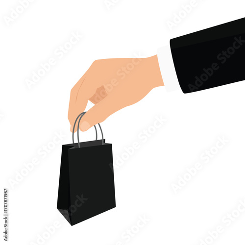 Businessman hand holding black paper shopping bag