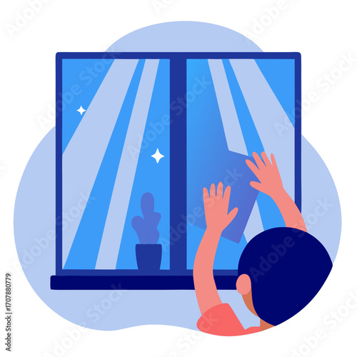 Child cleaning window with cloth while standing indoors  