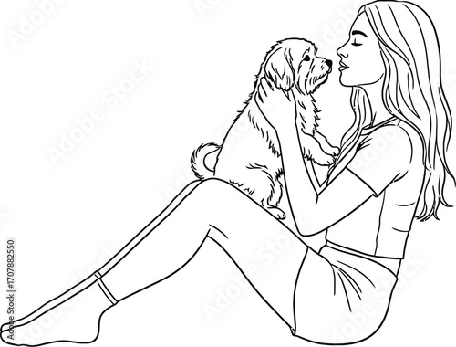 Young woman sharing a tender moment with her adorable puppy.