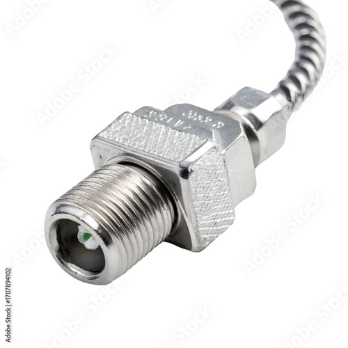 Close-up of a metallic industrial inductive proximity sensor with a threaded connector isolated on a white background