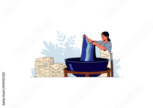woman dyeing cloth in natural indigo