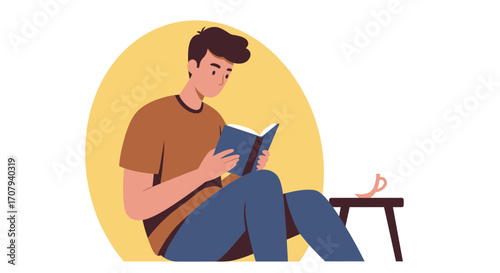 A young man sits on the floor, deeply engrossed in reading a book, with his glasses resting on a small stool beside him.