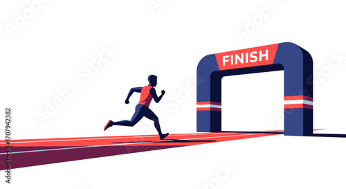 Male athlete running towards the finish line arch.