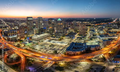 Wallpaper Mural American city skyline of Tampa in Florida. Brightly illuminated commercial buildings and high speed highway road. Night urban landscape of downtown district in USA. Torontodigital.ca