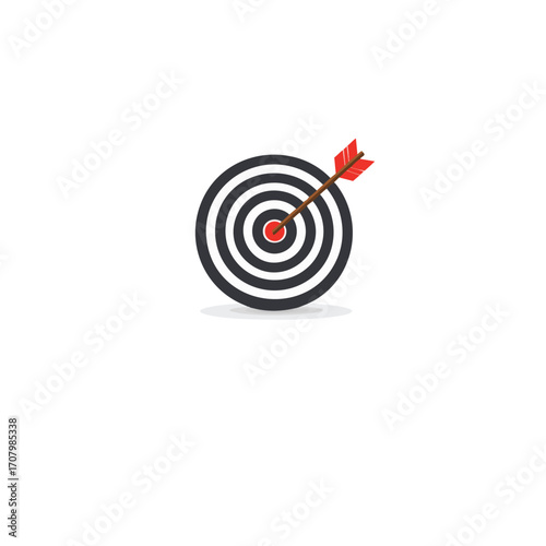 Aiming for the bullseye a red arrow hitting the center of a black and white dartboard