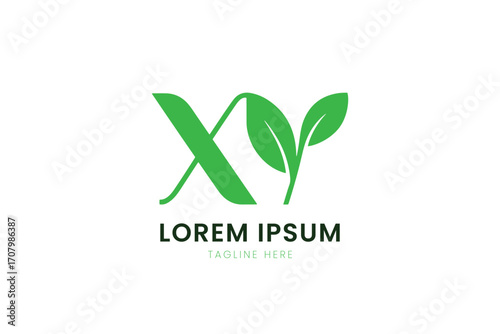 Minimalist green xy logo with leaves represents nature and growth on a clean surface