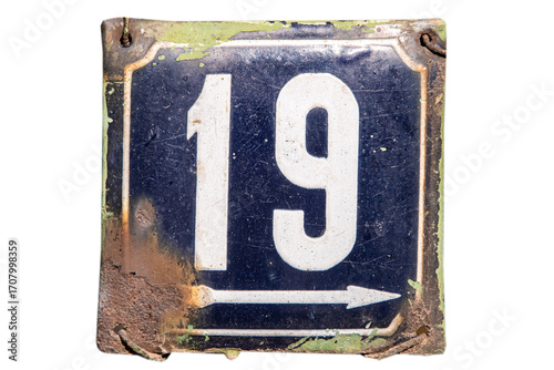 Weathered grunge square metal enameled plate of number of street address with number 19 isolated on white background