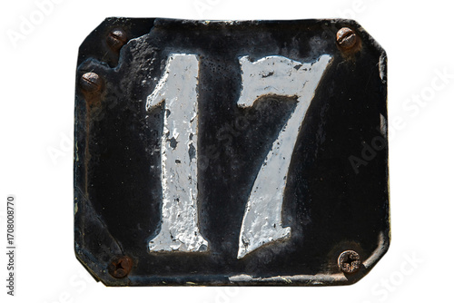 Old retro weathered cast iron plate with number 17 isolated on white background
