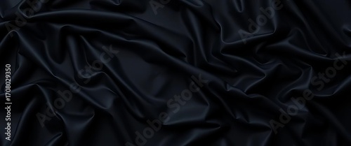 Deep black fabric with dramatic ripples and folds, creating a wavy textured surface,  background,  design