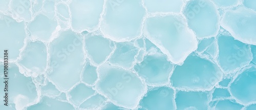 Pale blue ice floes pattern. Arctic landscape detail. Frozen water fragments create abstract texture. Cold climate environment. Polar region flora fauna background.