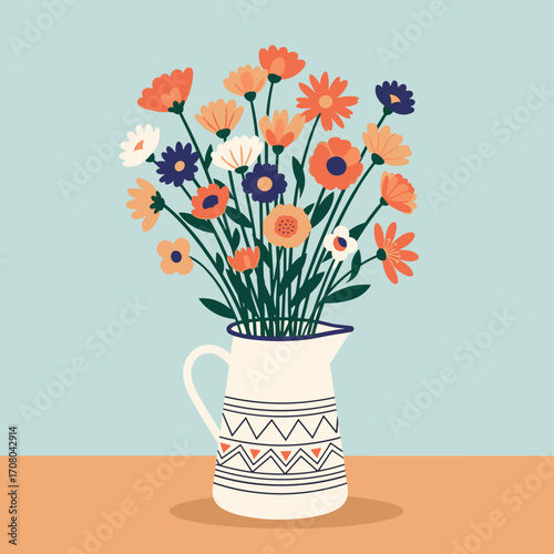 A colorful assortment of wildflowers arranged in a decorative jug on a table.
