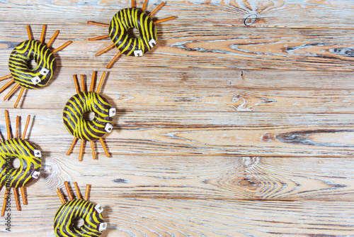 Spider doughnuts decorated for Halloween on rustic wood