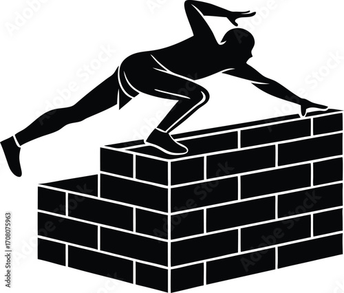 Silhouette of a Man Climbing a Brick Wall parkour