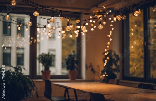 Warm string lights illuminating cozy meeting room