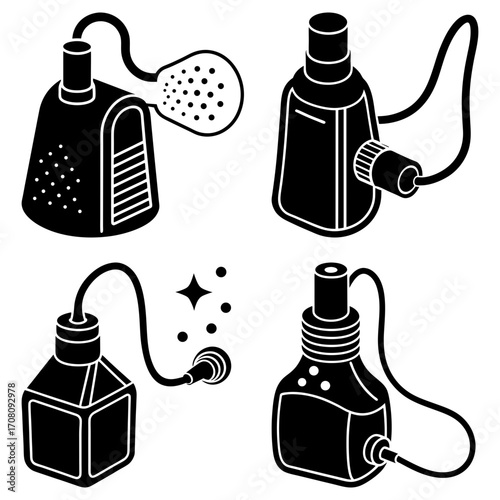 Collection of four black and white vintage perfume atomizers with hoses and various bottle shapes