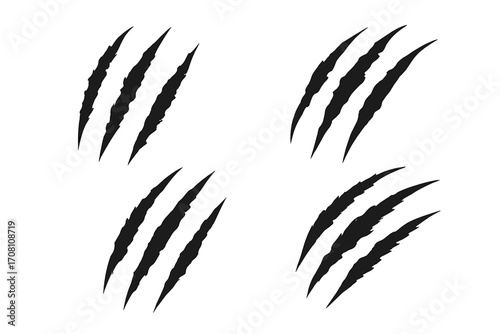 Claw scratch marks vector set. Animal claw slashes. Wild beast, tiger, or bear attack. Monster horror scrapes. Grunge ripped, torn paper effect. Black silhouette illustration.